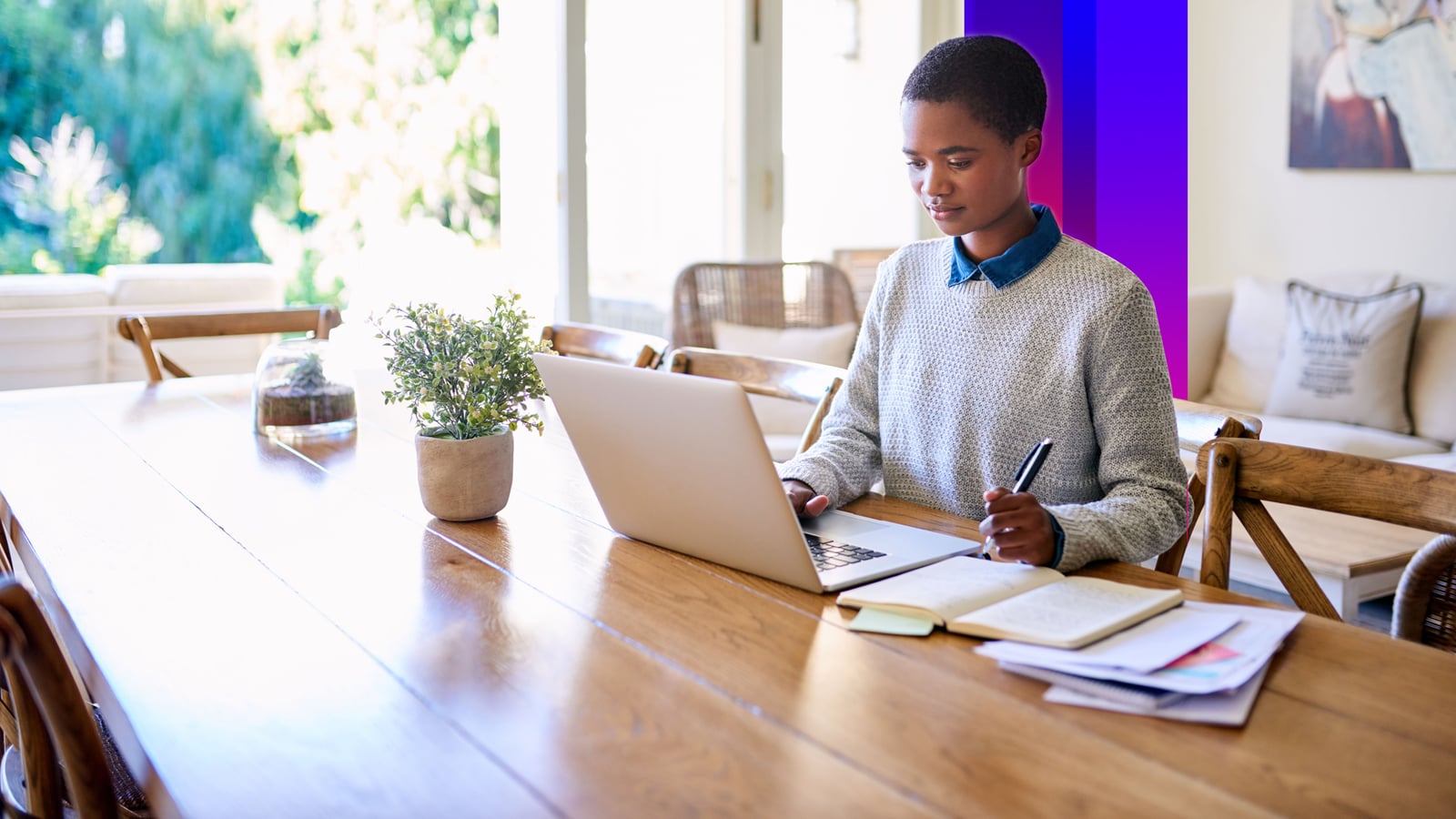 Focused young woman working from home