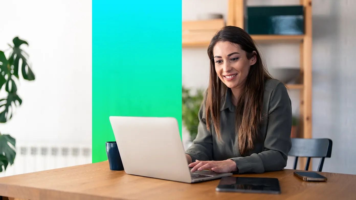 Woman working on a laptop at a table