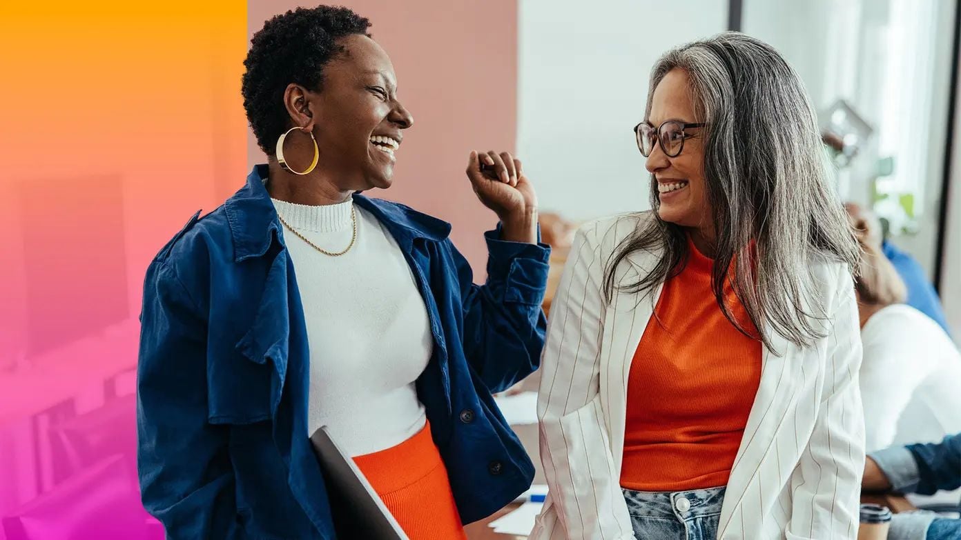 two women smiling and laughing